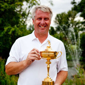 Roger Gray Golf Pro Coach Headshot with Trophy